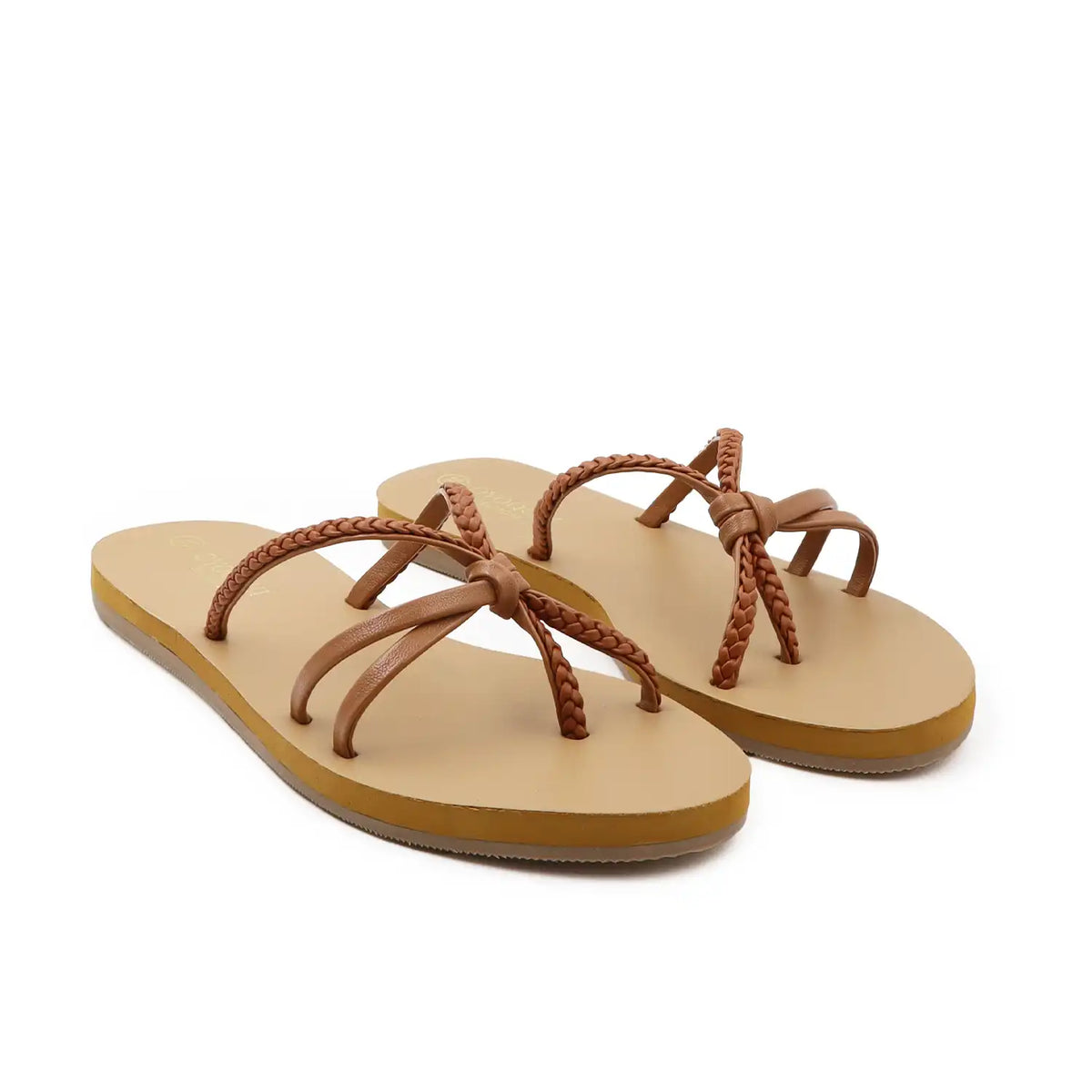 Pair of tan flats sandals for women with braided straps on a white background