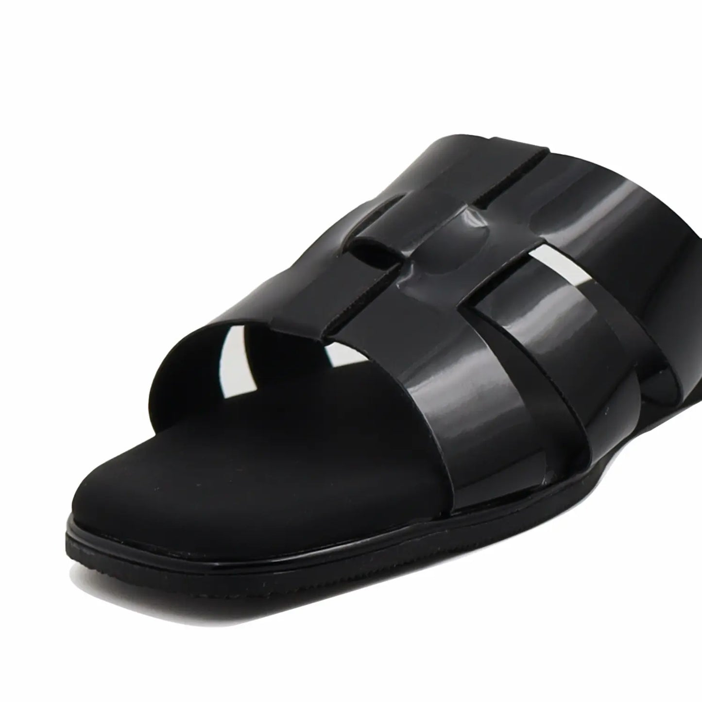 Black sandal with multiple straps on a white background