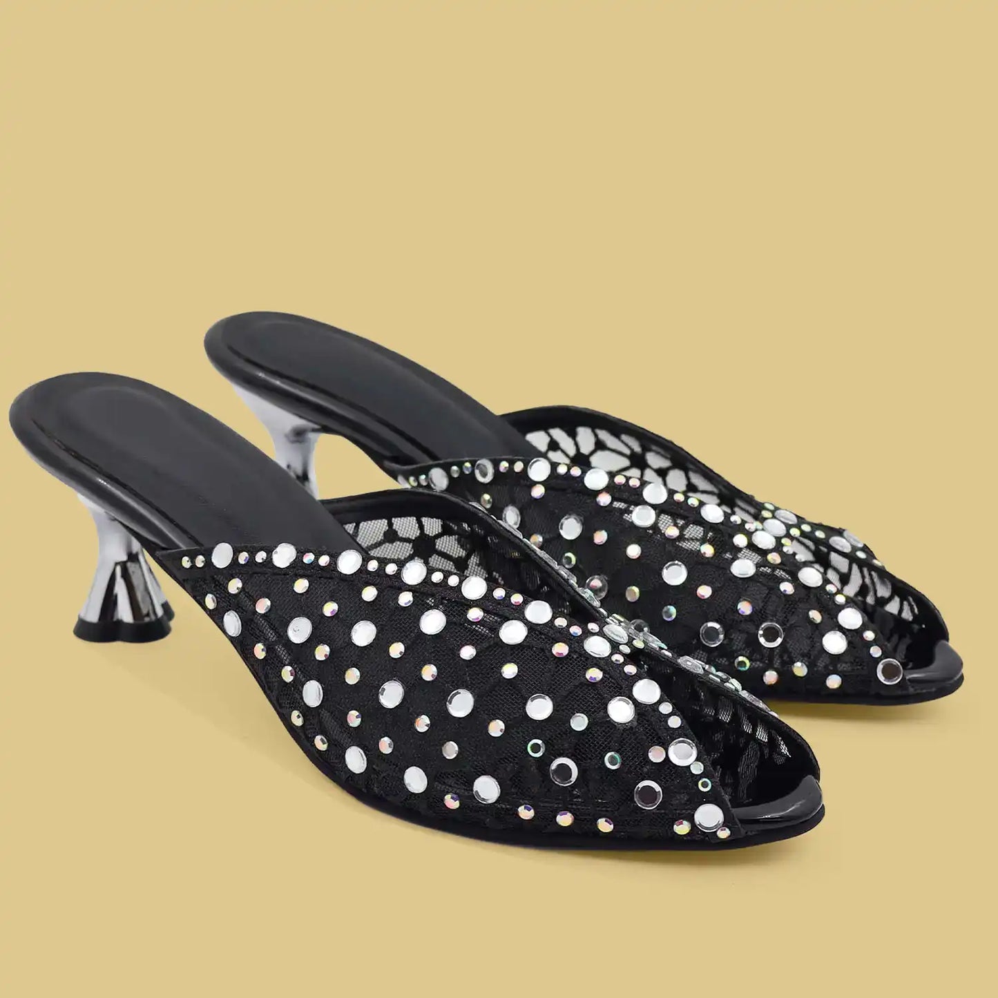 Black rhinestone embellished mule heels with mesh upper