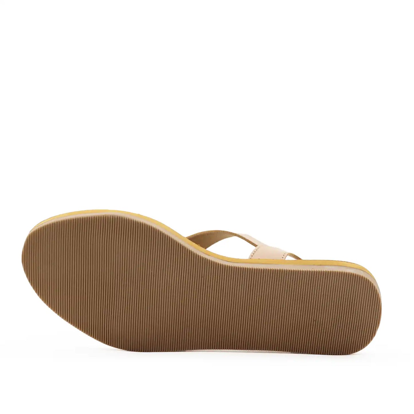A pair of women's minimalist flat sandals with crisscrossing straps and a tan sole, sole view