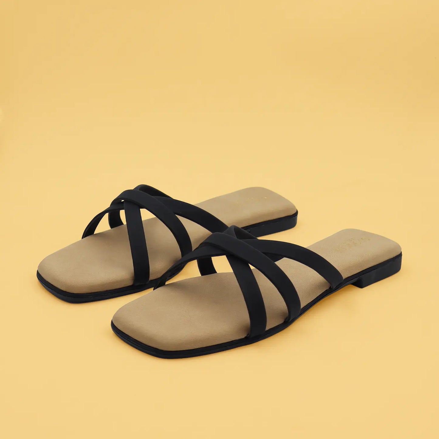 Pair view of oyoqchi's black flat strappy sandals for women.
