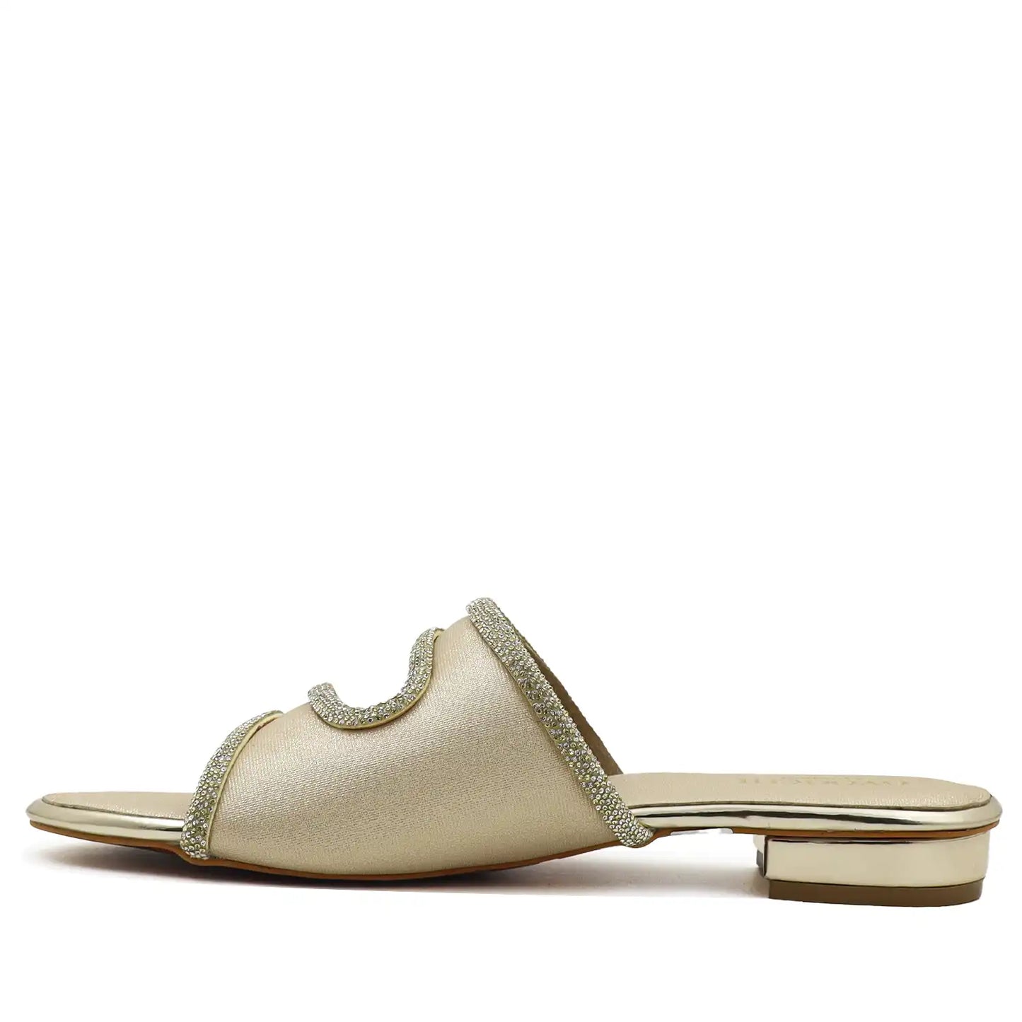 Side profile view of women's gold flat sandal