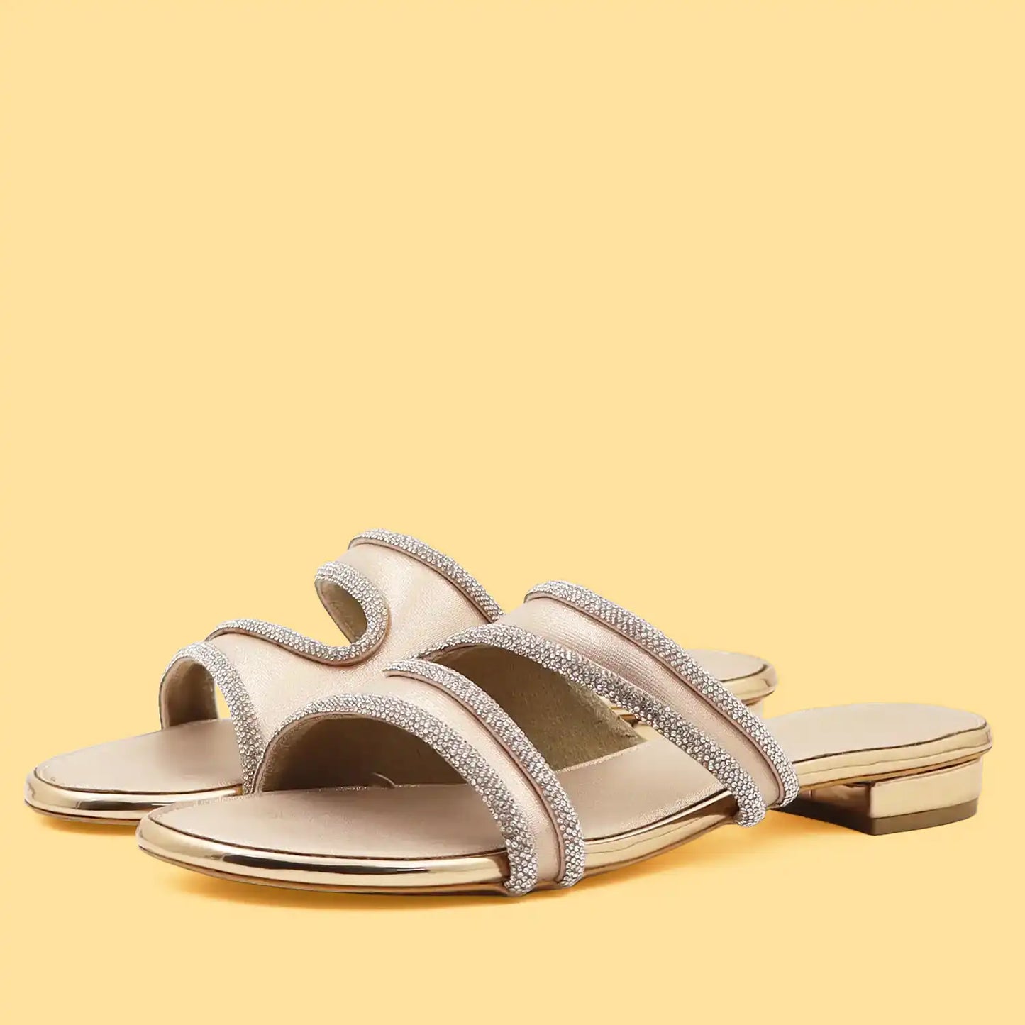 Pair of women's rose gold embellished flat sandals