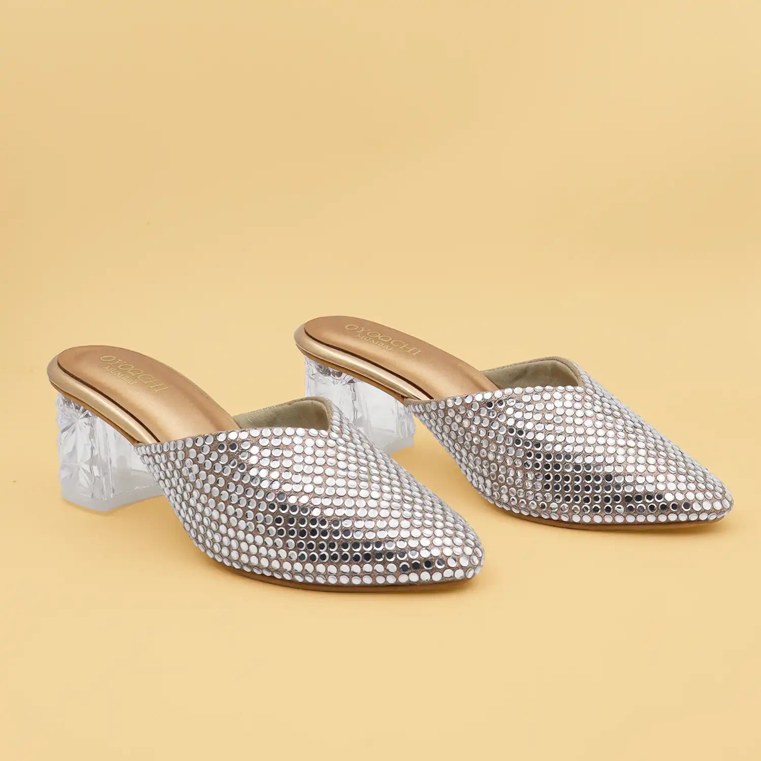 OYOQCHI women's 2-inch transparent block heel mules with crystal embellished upper and cushioned footbed in Rose Gold.
