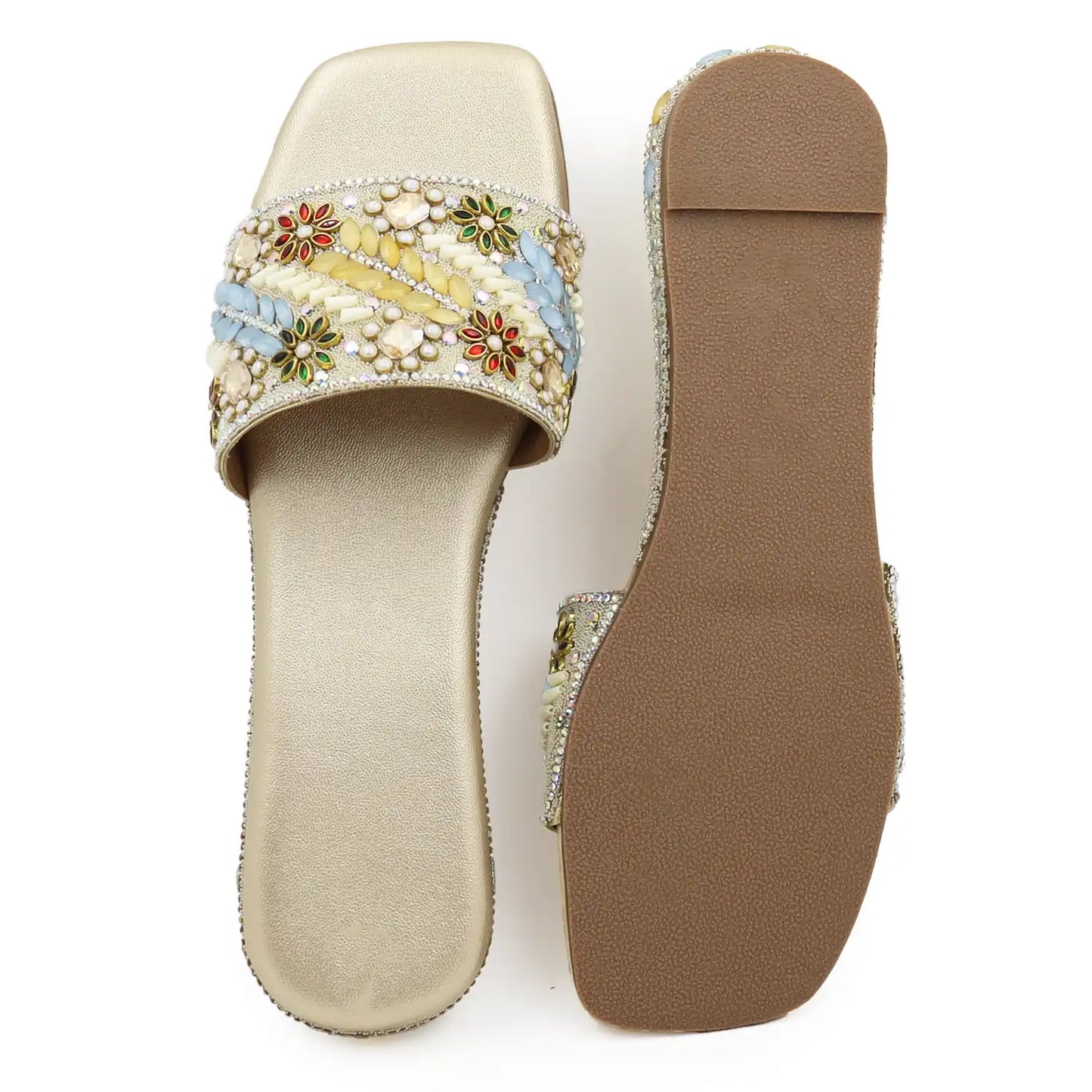 close view of women’s gold embellished ethnic flat sandal with beaded upper