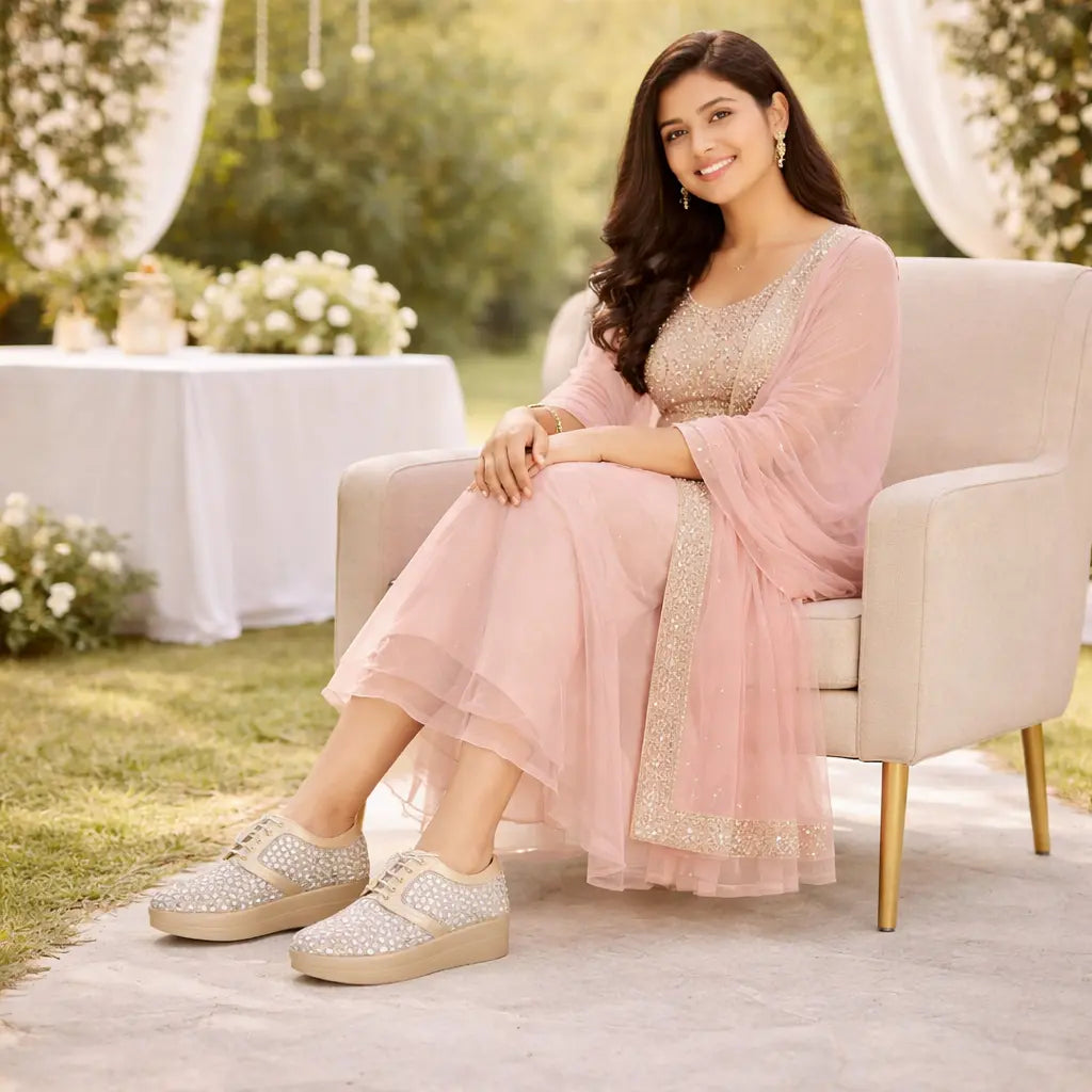 Lifestyle view of women's light gold bridal sneakers