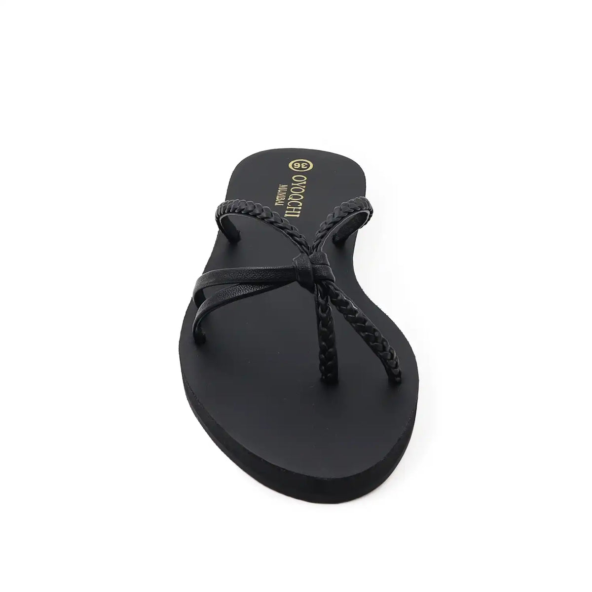 Black sandal with braided design on a white background
