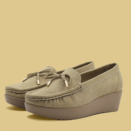 Women's beige wedge heel loafers side view