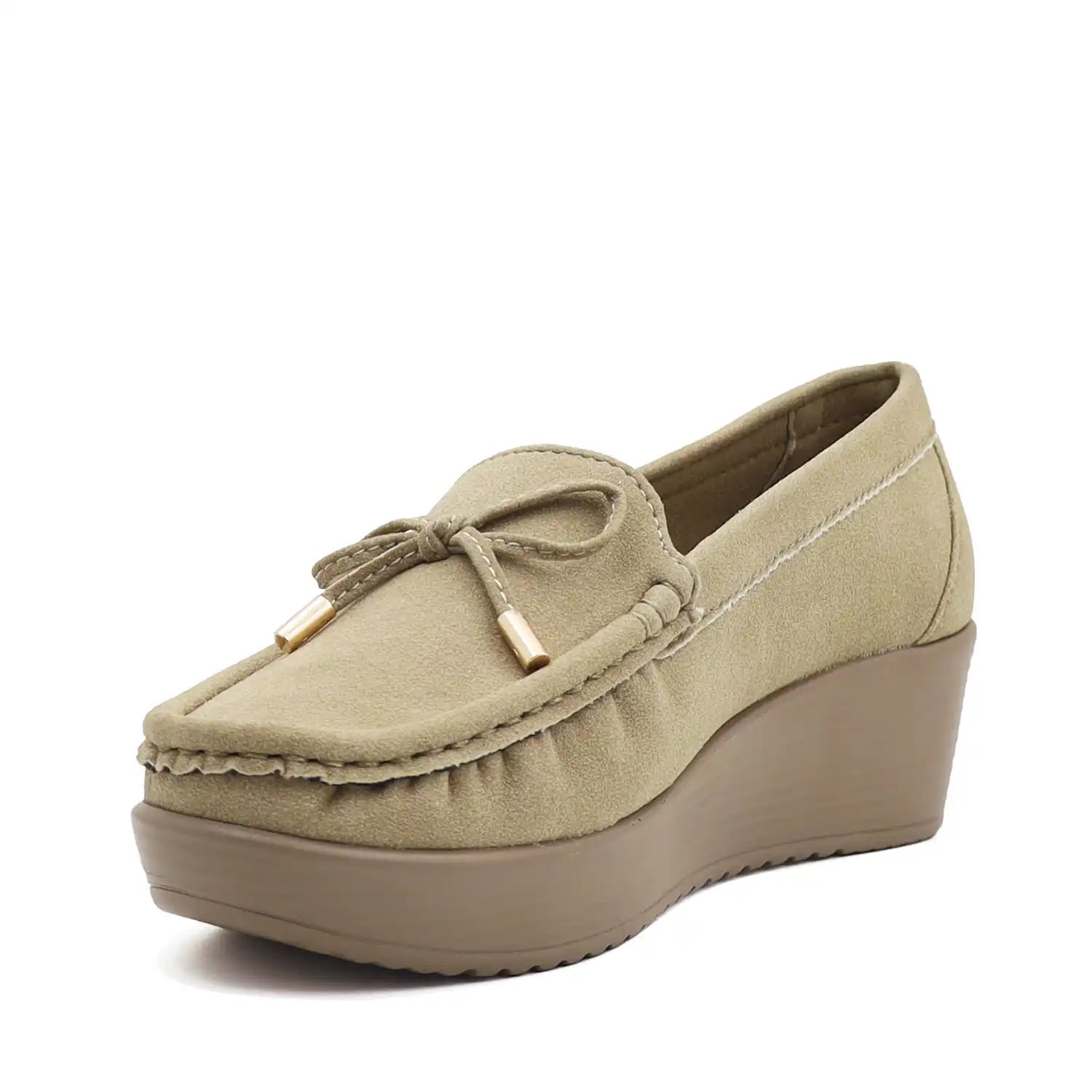 Angled view of women's beige wedge heel loafers