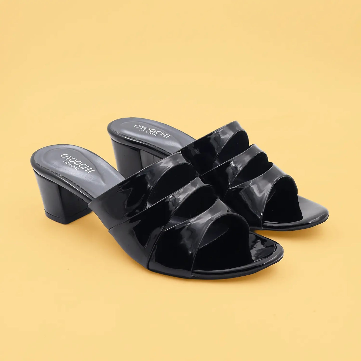 A pair of women's black block heel sandals