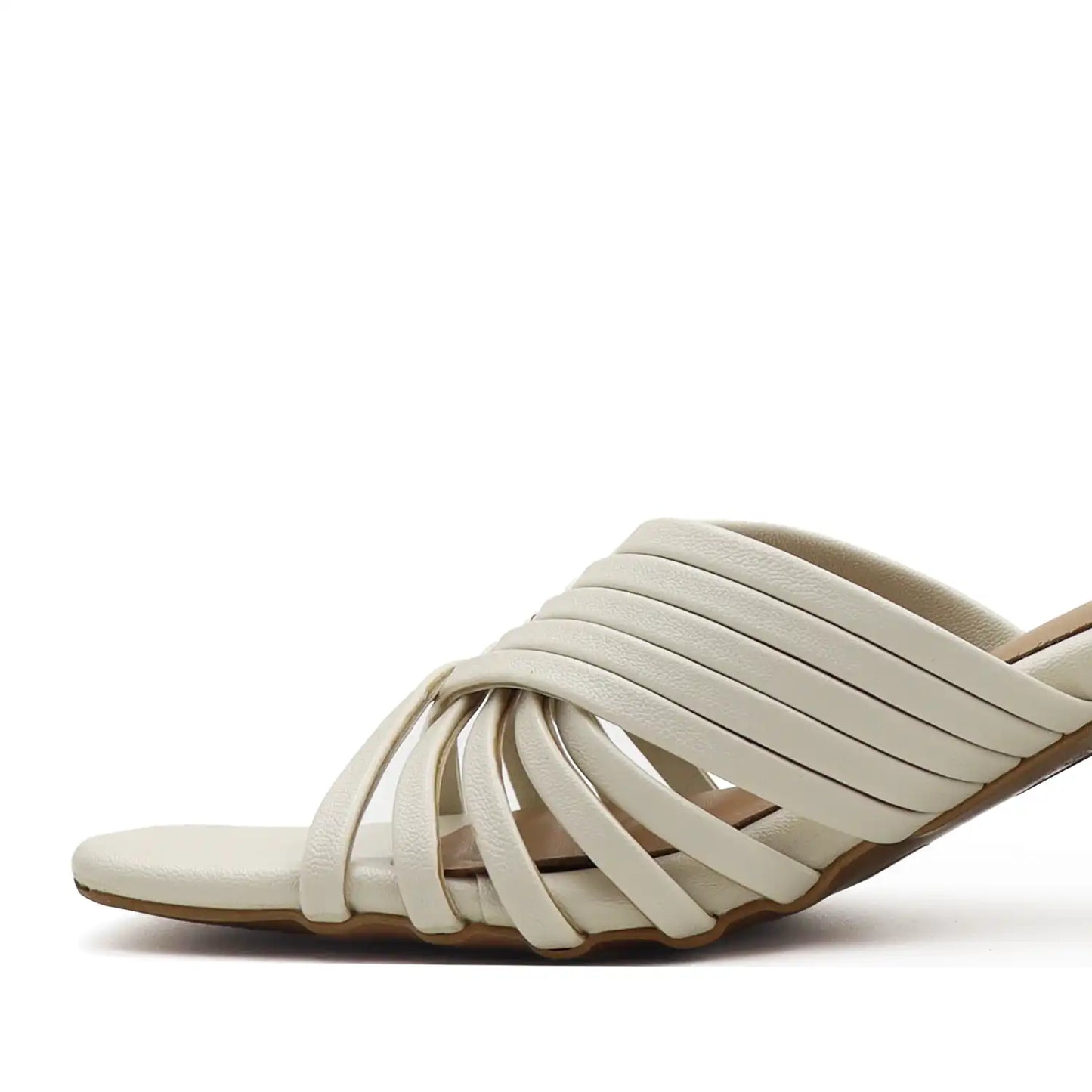 White sandal with multiple straps on a white background