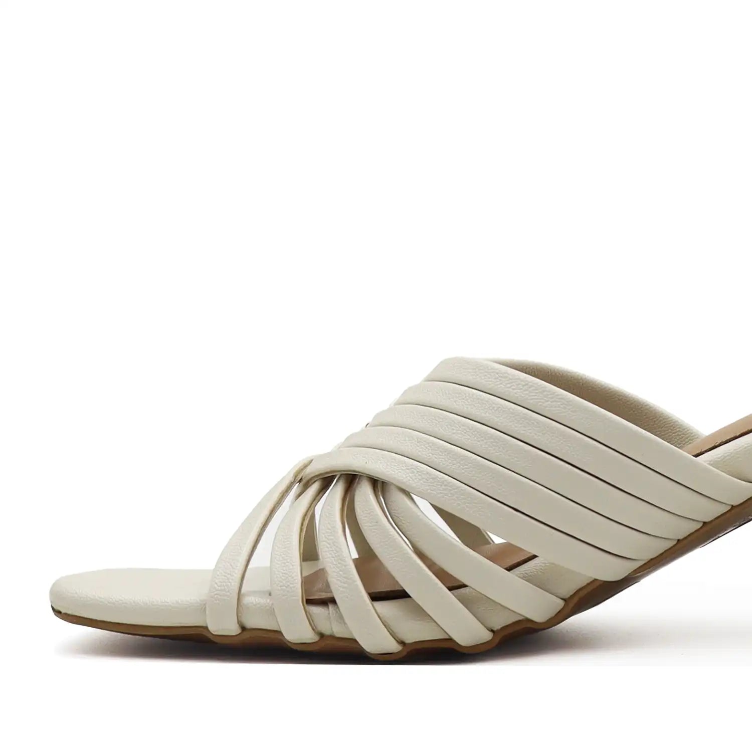 White sandal with multiple straps on a white background