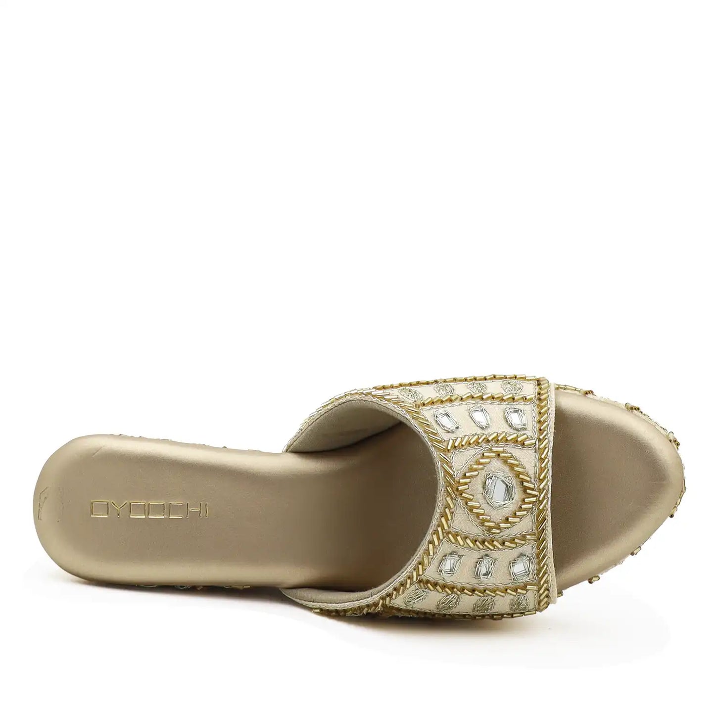 Top view of women's ethnic gold wedge sandals
