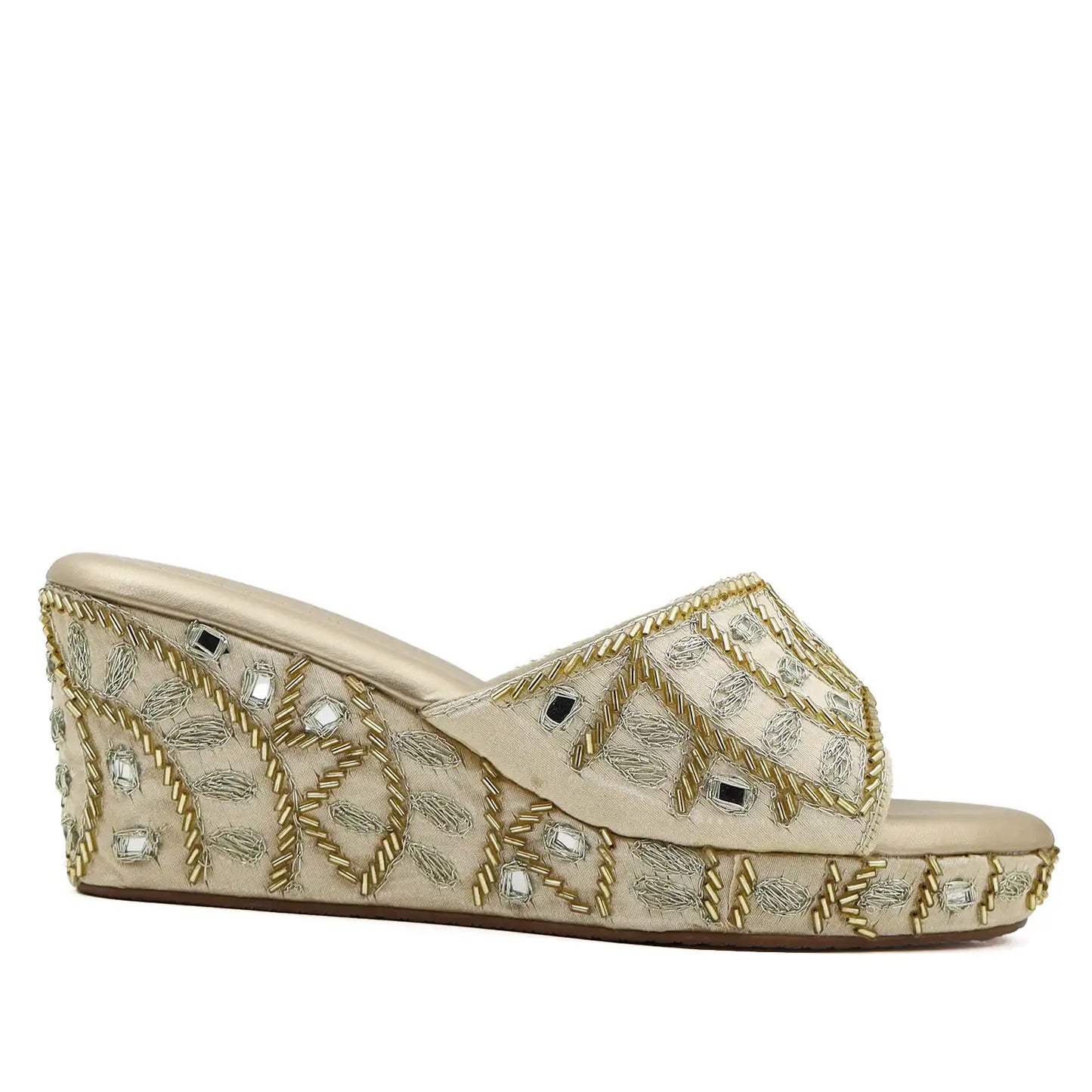 Side profile view of Women's ethnic gold wedge sandals
