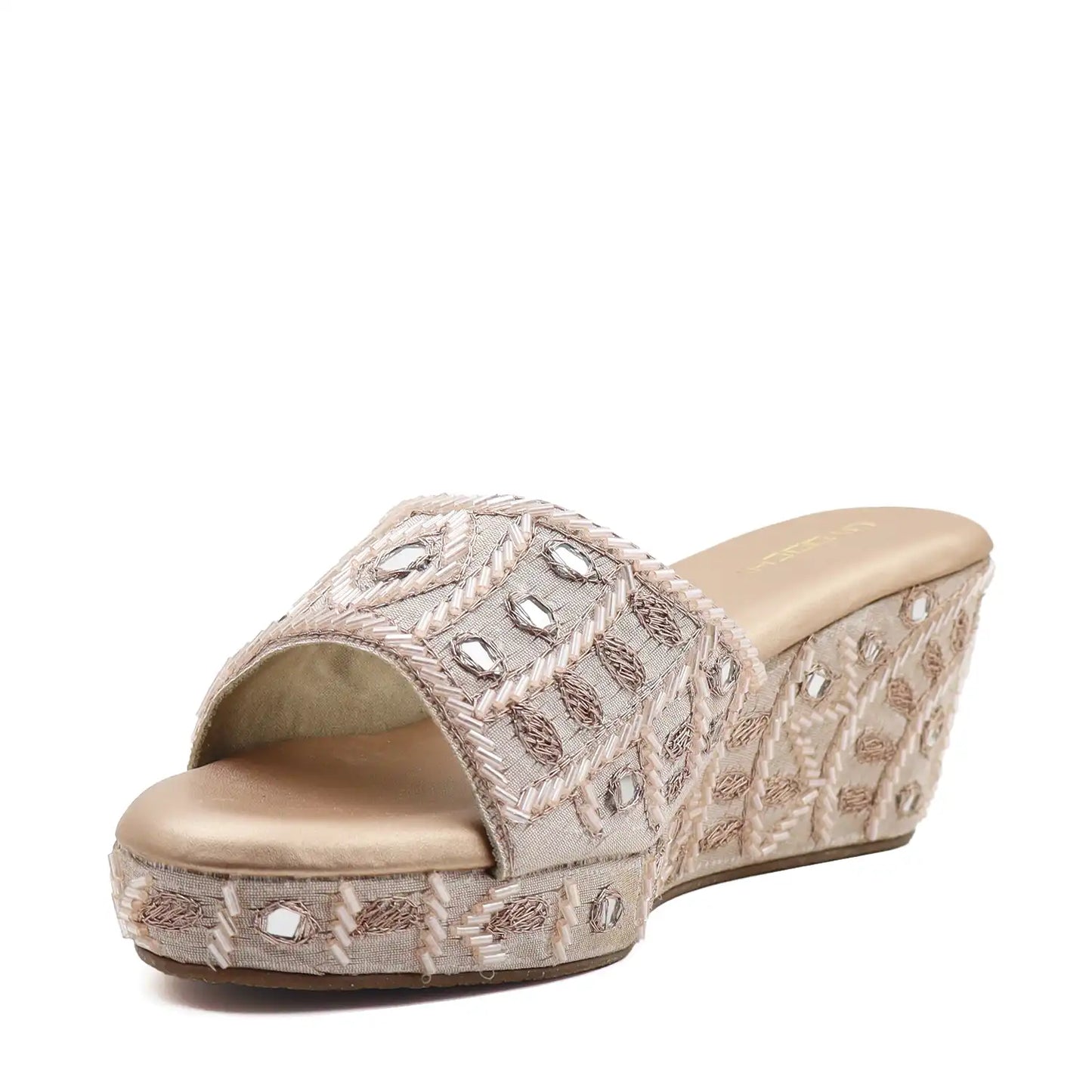 Women's ethnic rose gold wedge sandals, angled view