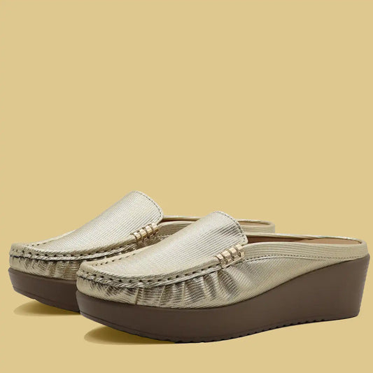Gold women’s mule loafers pair front side view
