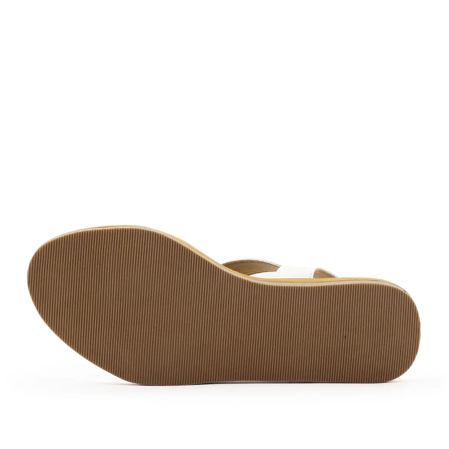 Women's white criss-cross flat sandals with a brown sole, sole view