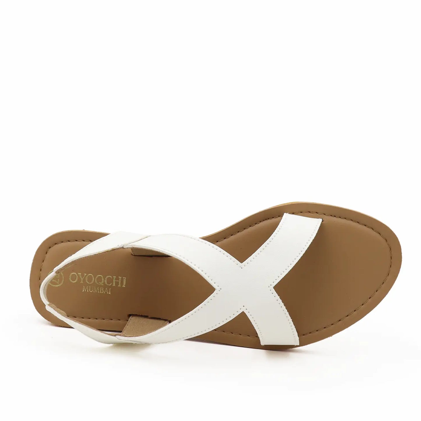 Women's white criss-cross flat sandals with a brown sole, top view