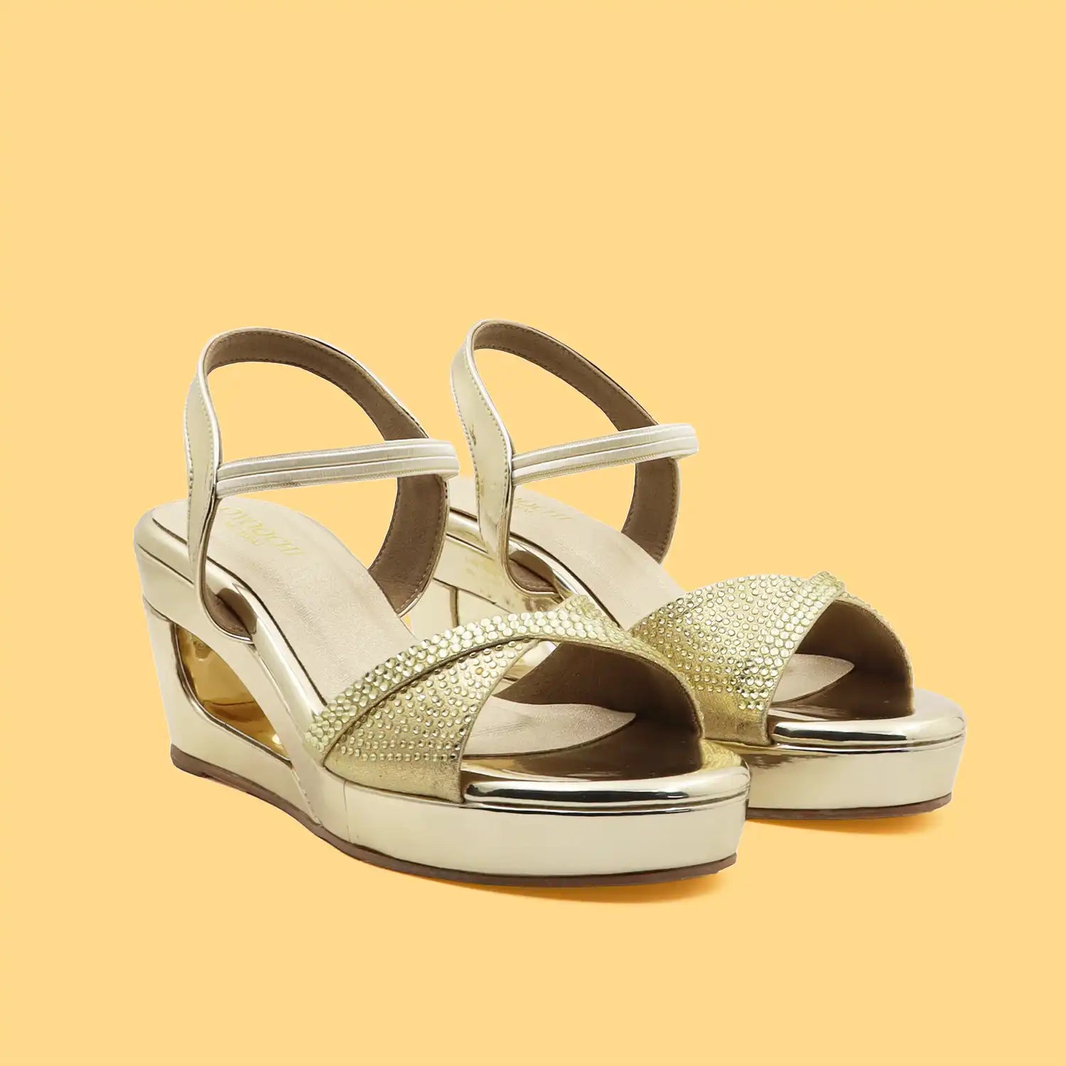 Women's 3 inch wedge heel comfortable gold embellished sandal, angled pair view