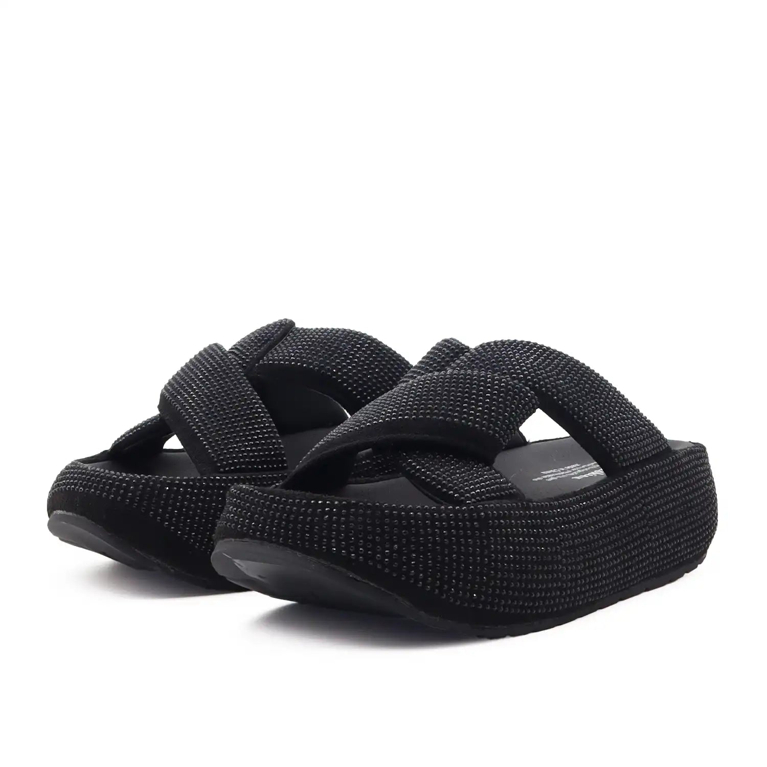 A pair of black women platform slide sandals with wide, textured woven straps, shown on a plain white background.