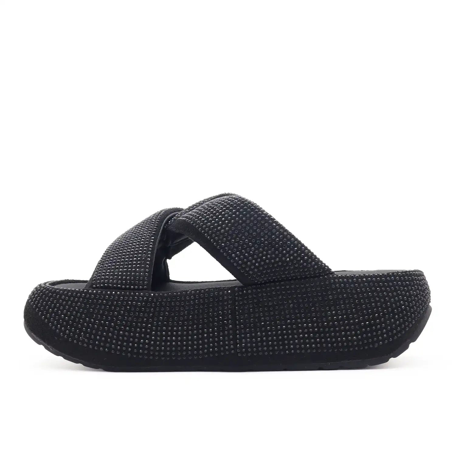 A single women's black platform slide sandal covered in small rhinestones, 