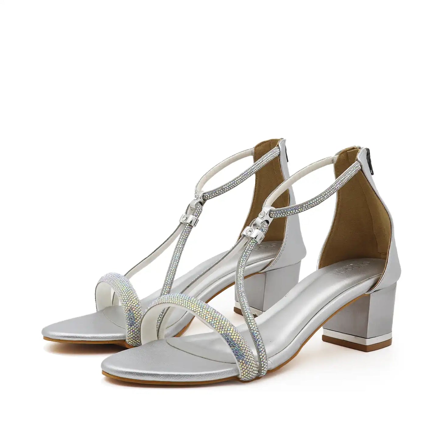 Pair view of women's silver block heel strappy sandals with delicate straps on it