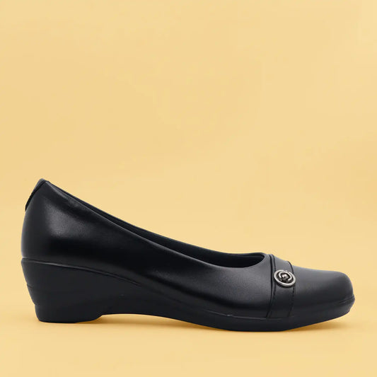 Women's black wedge shoe with a low block heel and comfortable shoe bed, side view